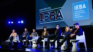 A panel of speakers at the podium during an IEBA conference.